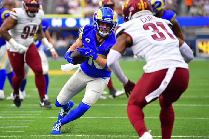 Dec 17, 2023; Inglewood, California, USA; Los Angeles Rams wide receiver Cooper Kupp (10) runs the ball against Washington Commanders safety Kamren Curl (31) during the first half at SoFi Stadium.